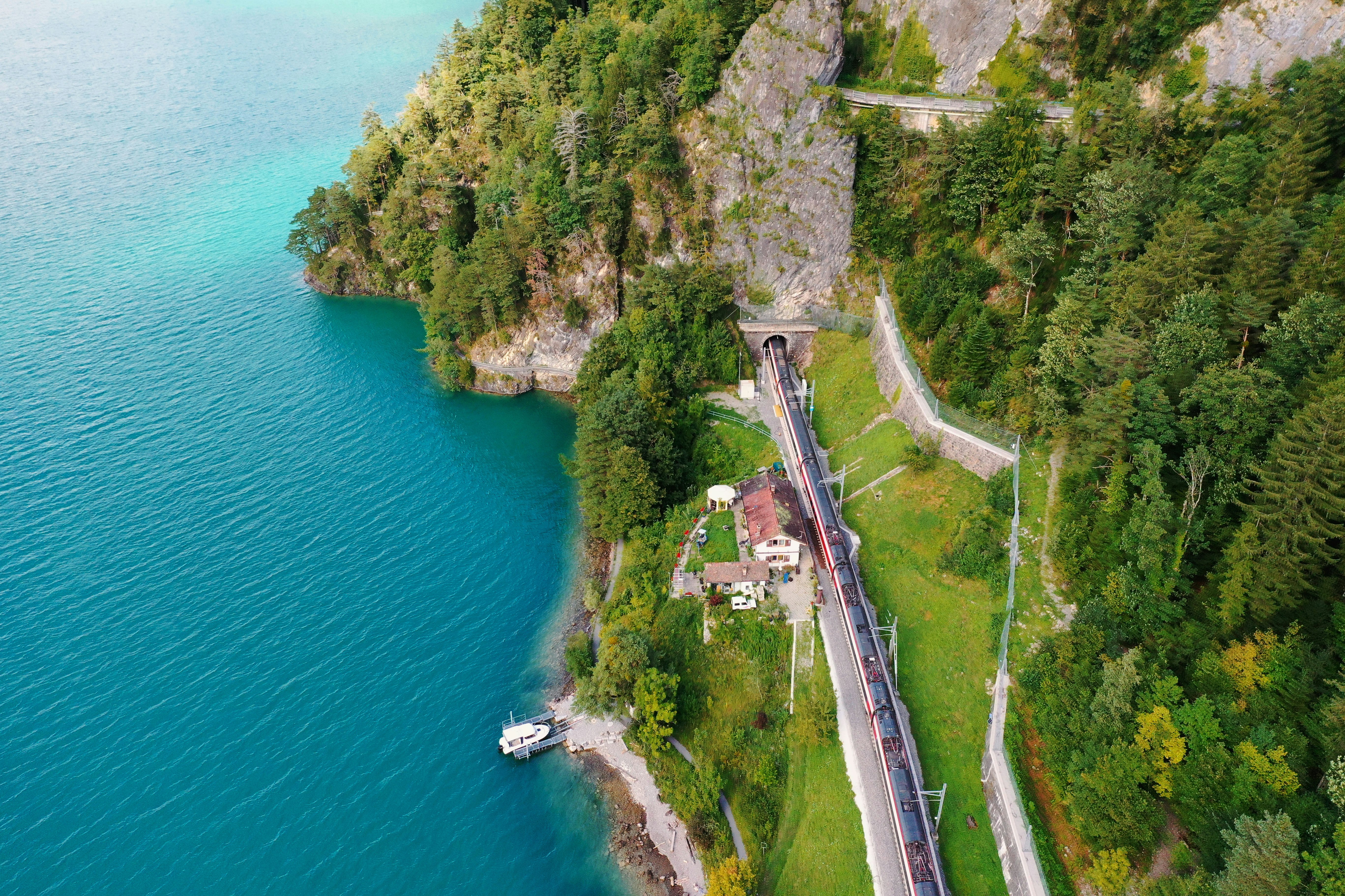 aerial view of road near body of water during daytime